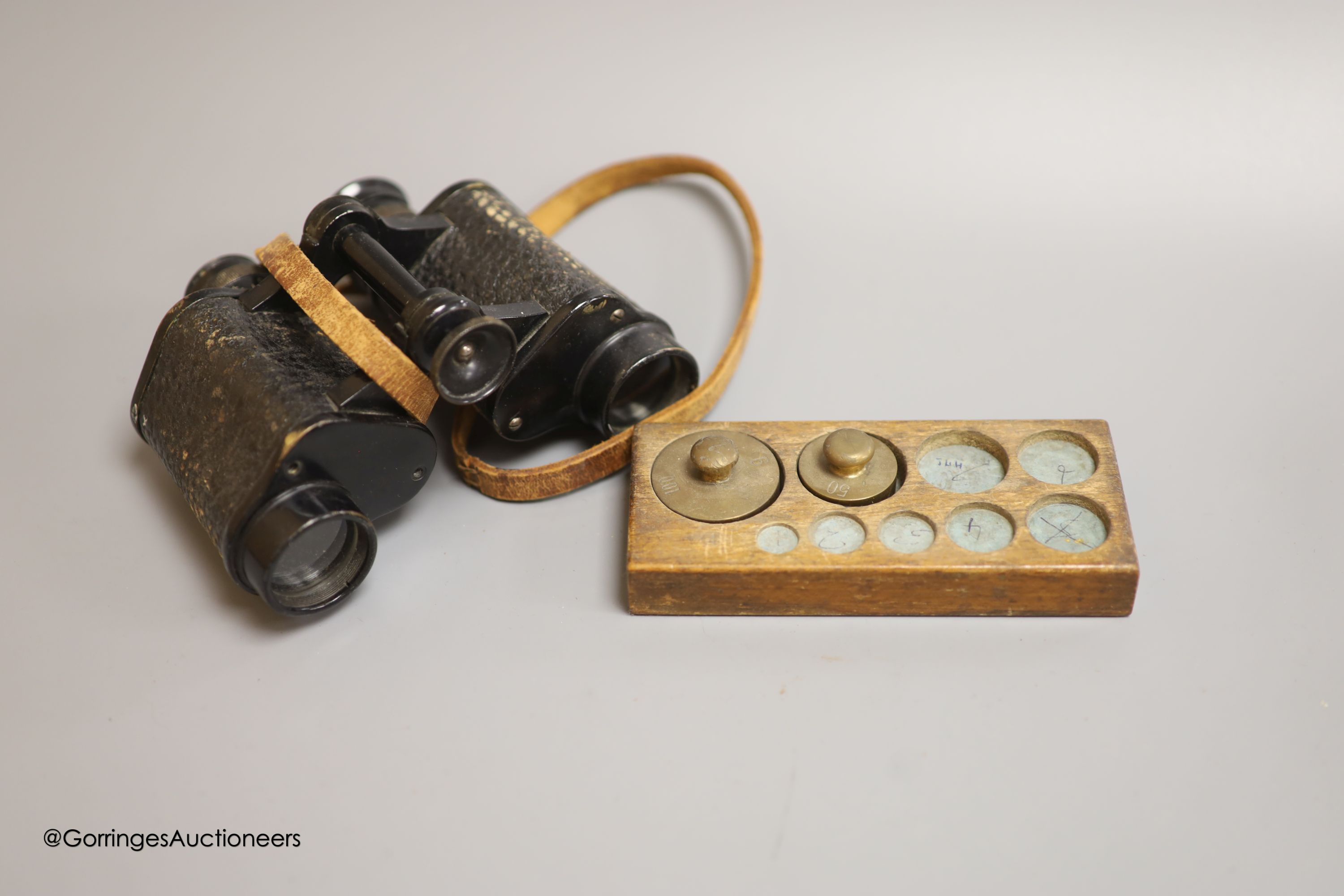 Four shot balls, two daggers, various weights, a pair of binoculars and Chinese hardstone cameo beads etc